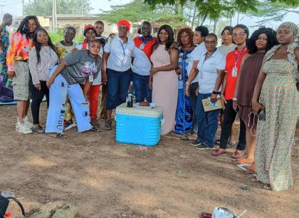 Women from the Liberian community gathered outdoors in fellowship